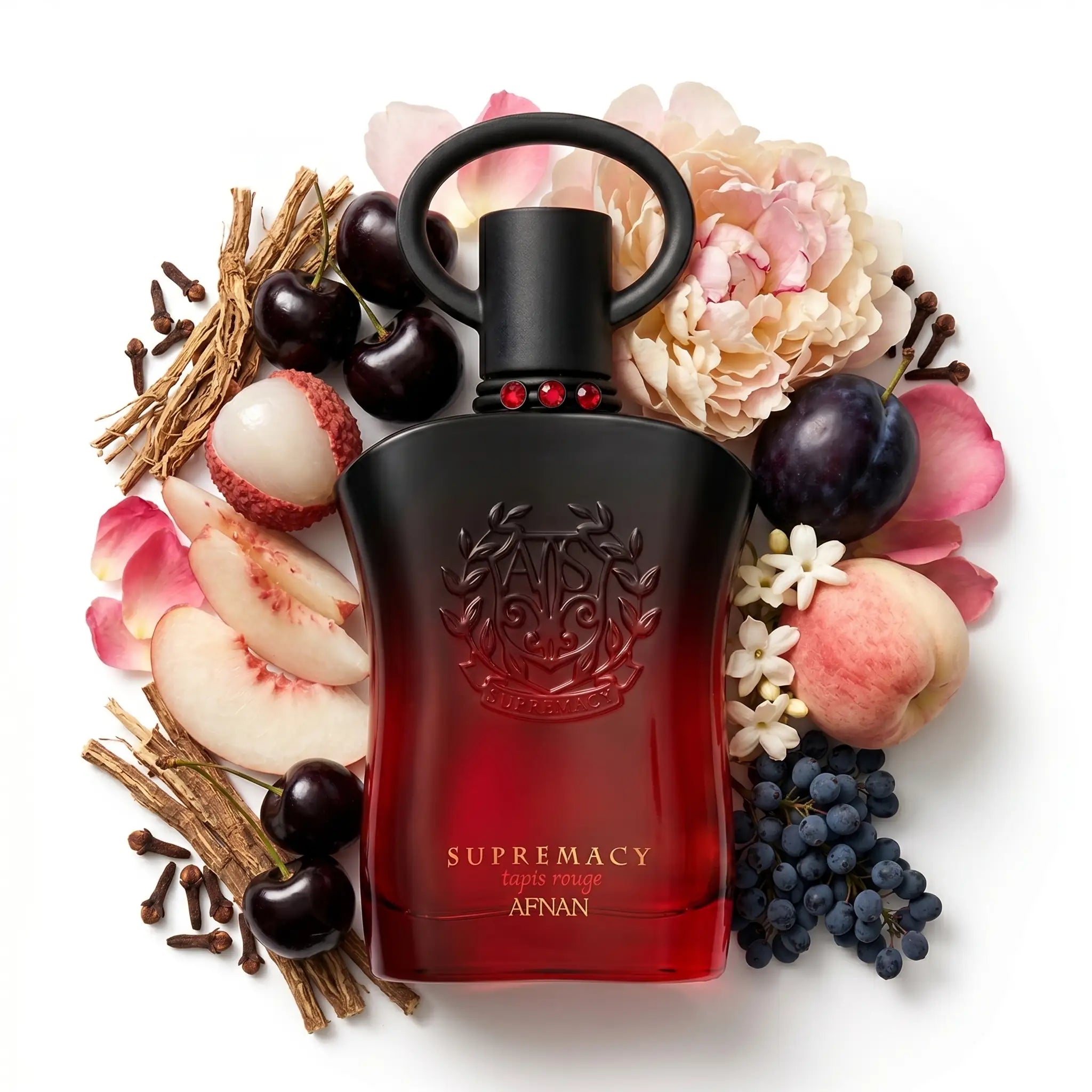 Supremacy Tapis Rouge Afnan Eau de Parfum con fondo de ingredientes blanco