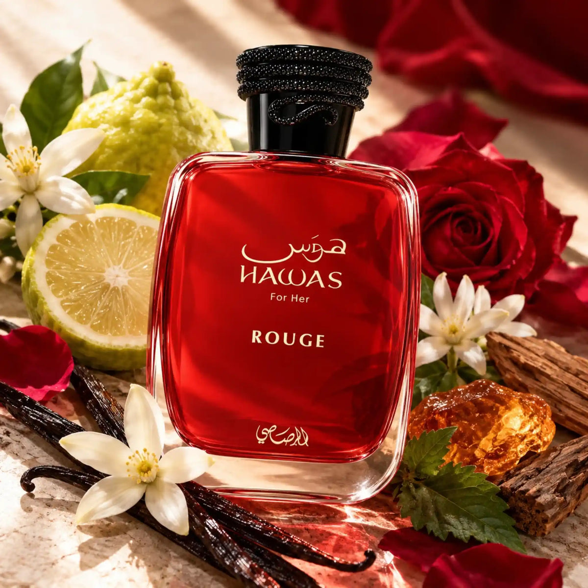 Botella de Hawas Rouge Rasasi Eau de Parfum entre flores y cítricos sobre fondo creativo